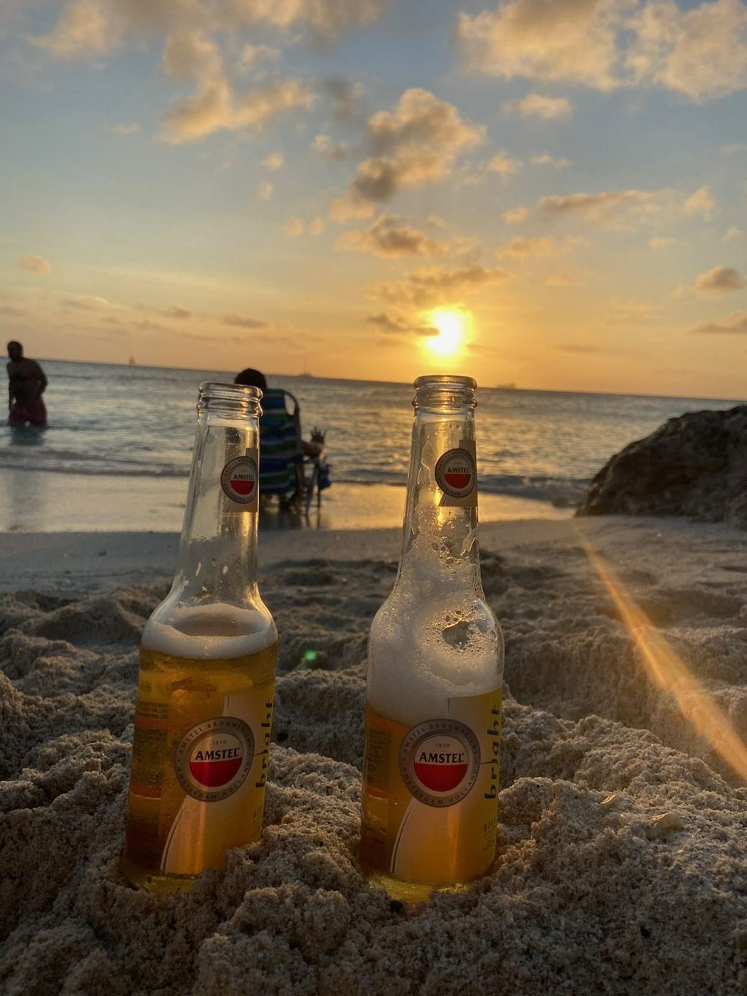 Two cold beers in the sand at sunset on Palm Beach